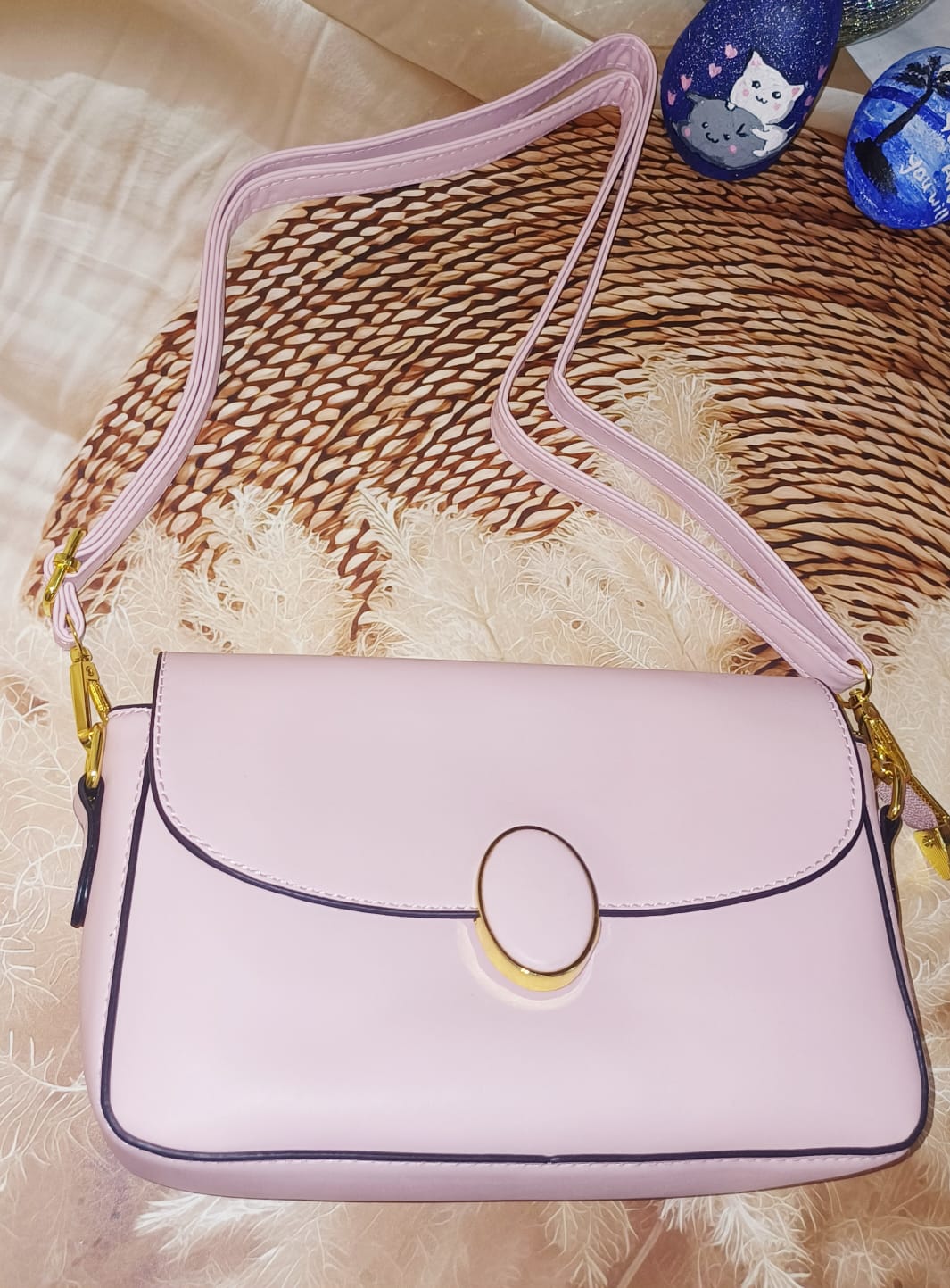 Peach Oval Lock Sling Bag