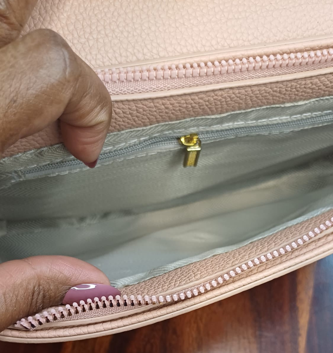 Peach Metal Lock Textured Sling Bag